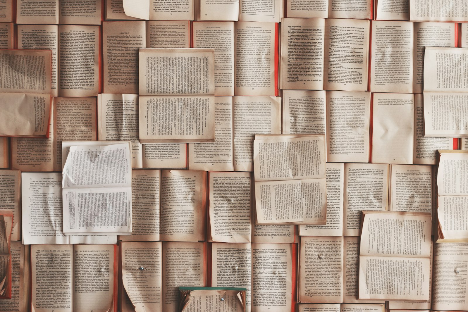 Mosaic of open book pages, academic publishing texture